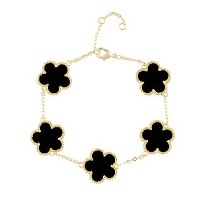 Necklace with black flower-shaped pendants on a white background
